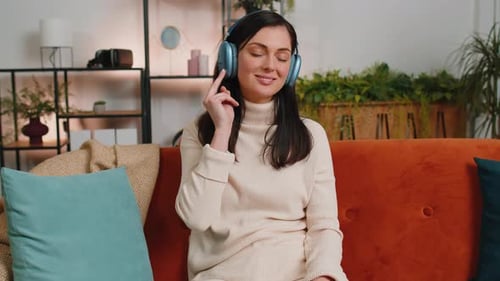 Woman Listening to Music with Headphones and Dancing