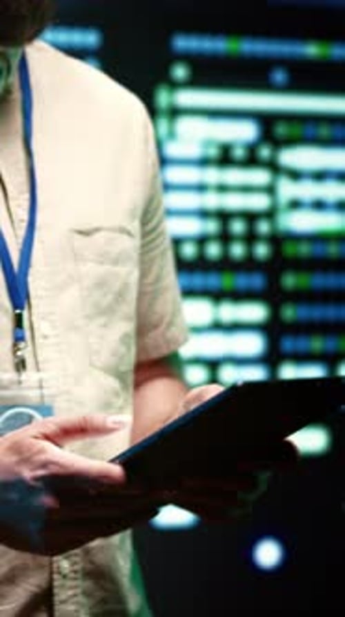 Man Using Tablet in Futuristic Tech Environment