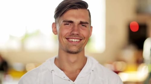 People, Emotion and Facial Expression Concept - Face of Happy Smiling Young