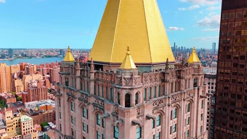 Roof of the beautiful skyscraper with yellow cupolas on top.