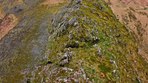 Close-up Drone View Of Eystrahorn Mountain's Rocky And Grassy Ridge Lines
