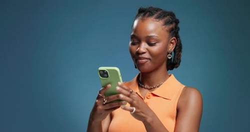Laugh, space and black woman in studio with phone, communication and funny post on social media