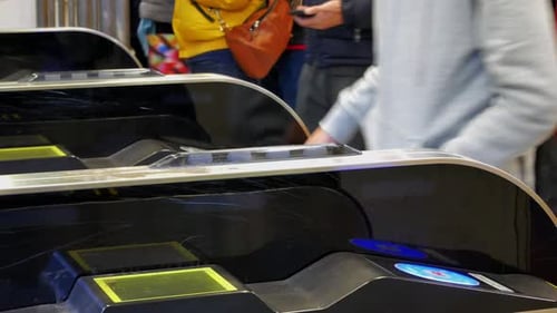 Close up view of the ticket gate in the train station with many passenger get through the ticket gat