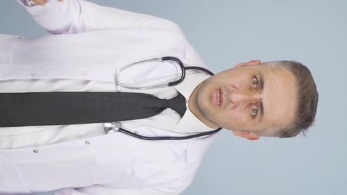 Doctor Talking and Raising His Fist