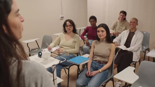 Students Listening to a Lecture in a Classroom