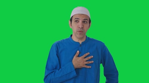 Sick Muslim man suffering from Cold and cough Green screen