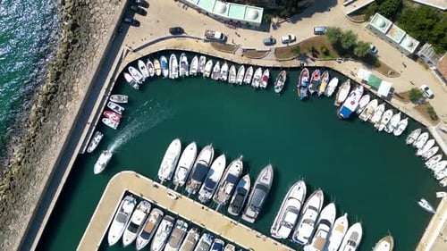 Bay with boats and Torre Truglia tower in Sperlonga coastal town of Italy