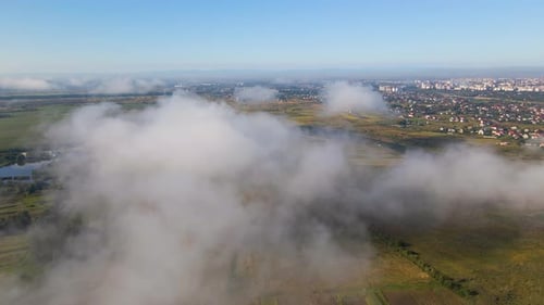Top View From Above of Landscape Covered with Puffy Morning Fog Cold Humid Air Condensing in Rain