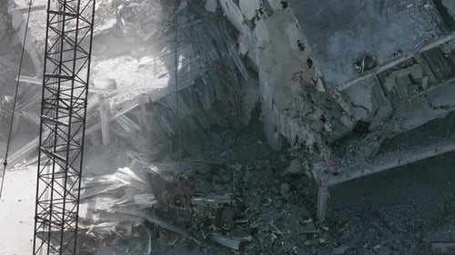 Excavator Working Rubbish in a Demolition Site Top Down Wide Drone Footage of Over Destroyed