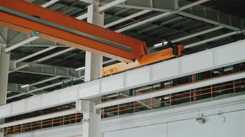 The Crane Beam Moves Along the Rails at the Factory