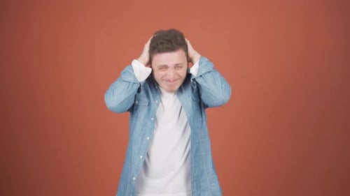 Young Adult Man Expressing Various Emotions in Studio