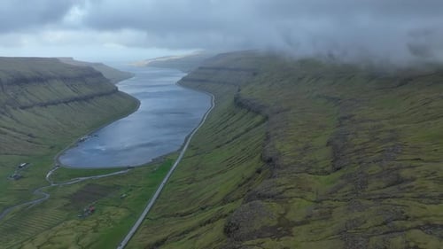 Aerial view of a winding fjord in the Faroe Islands