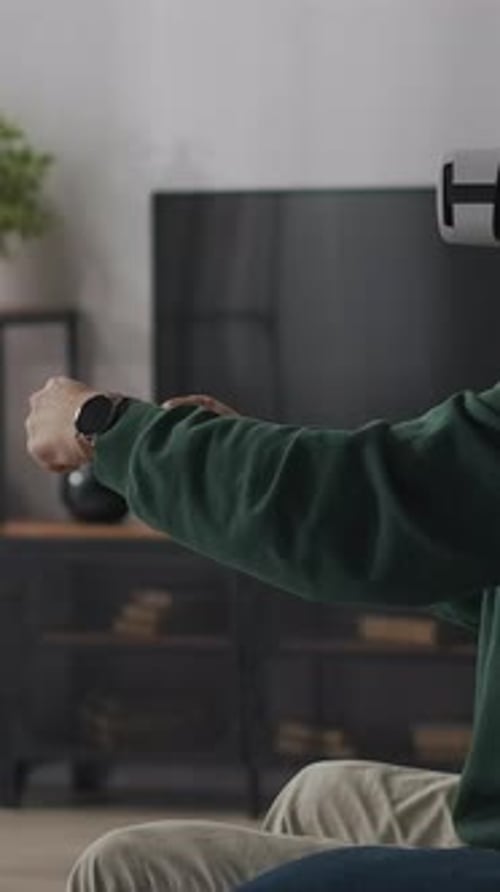 Man Experiencing Virtual Reality with Headset in Living Room