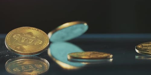 Golden bitcoin falls on the table