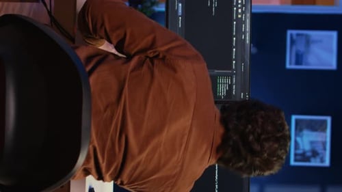 Computer Scientist at Home Office Desk Writing Binary Code and Drinking Coffee