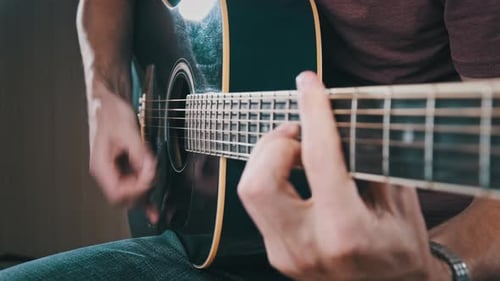 Man Playing Acoustic Guitar Close Up