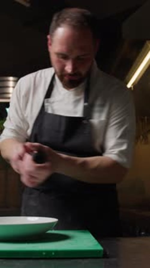 Chef Preparing Food in Restaurant Kitchen