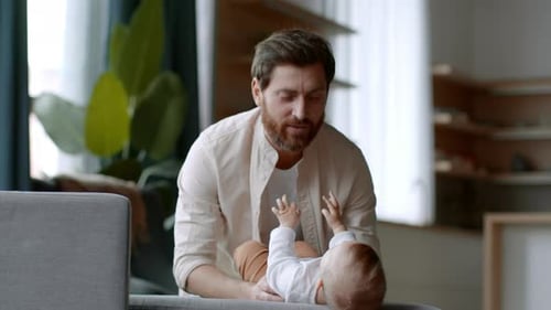 Father Playing with Baby Indoors with Love and Care