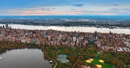 Panorama of the famous Central Park in New York. Drone footage above the vast city scenery at sunset