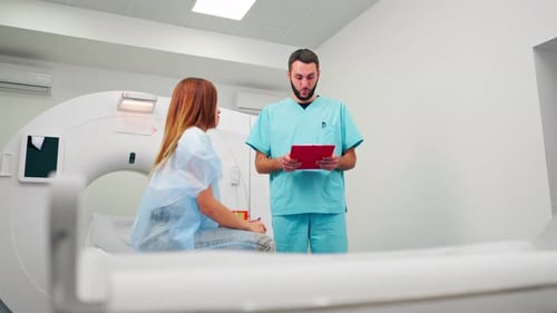 Doctor Talking to Patient Before CT Scan