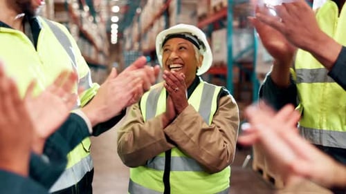 People, happiness and celebration in warehouse for success, support and solidarity with applause