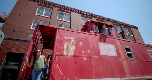 Happy couple takes photo on vintage santa fe train at wichita transportation museum