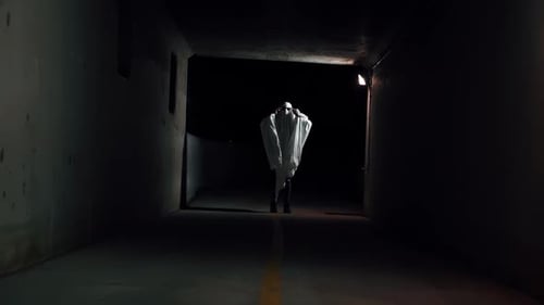 Spooky Ghost Figure Walks in Dark Tunnel
