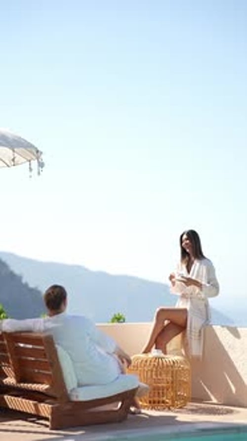 Couple spending quality time together in an infinity pool at a luxury destination.