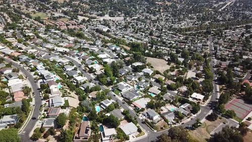 Aerial top down of upper class housing area in Hidden Hills with tennis fields. Sunny summer day in