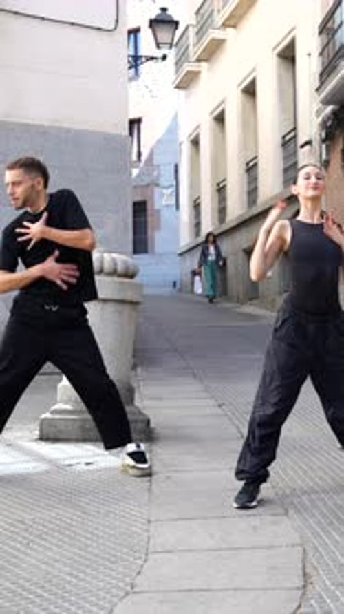 Talented Street Dancers Performing Synchronized Choreography in an Urban Alley