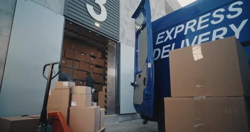 Team of Diverse Employees Unloading Delivery Truck with Cardboard Boxes Time Lapse