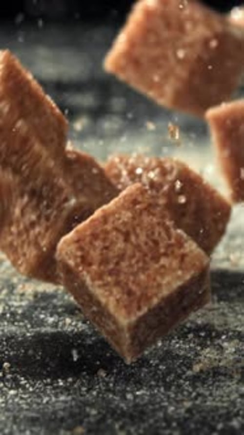Cane Sugar Cubes Fall on the Table Filmed on a Highspeed Camera at 1000 Fps