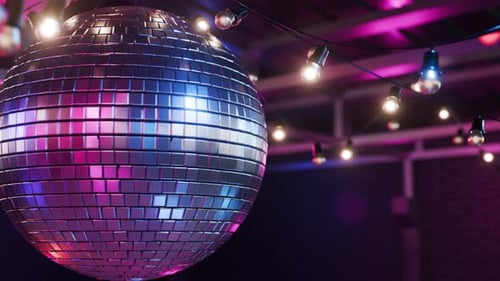 Looping 3D animation of a spinning disco ball. Spinning disco ball with glare on mirrors. VJ loop. D
