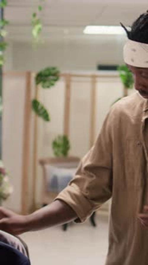 Vertical Video Man Buying Shirts and Blazers in Mall