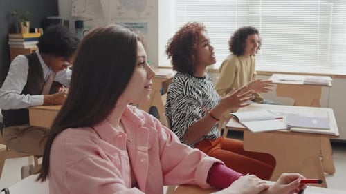 Students Listen to Lecture in Classroom Setting