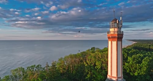 Beautiful lighthouse at sunset in Rewal at Baltic Sea.