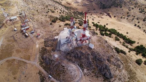 Telecommunications station with several antenna towers. Aerial top view.