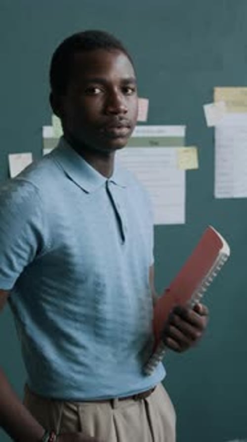 Portrait of Black Male College Student in Classroom