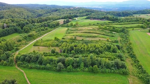 Valley with Fields Meadows Agricultural Farms Forests and Houses