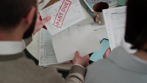 Wife Comforting Husband Angry about High Gas Rates on Overdue Bill