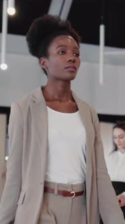 Confident Afroamerican Elegant Female Executive Walking Into Office Cabinet Through Corporate