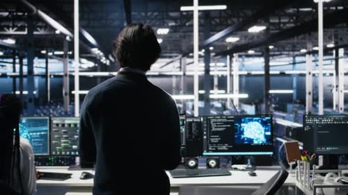 Admin Entering Data Center Office Reviews AI Diagnostics on Computer