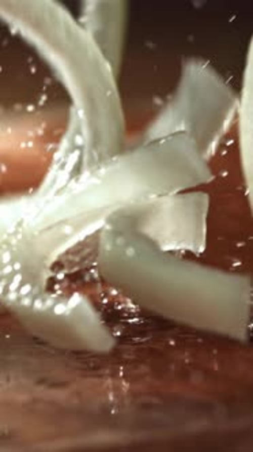 The Chopped Onion Falls Onto the Cutting Board Filmed on a Highspeed Camera at 1000 Fps