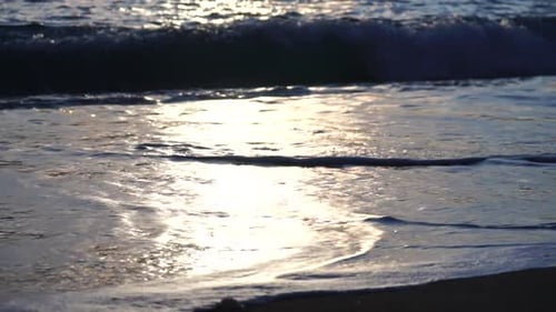 Small Sea Wave Blurred Soft Foamy Waves Washing Golden Sandy Beach on Sunset