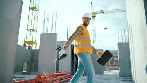 Construction Worker Walking Confidently on Urban Building Site