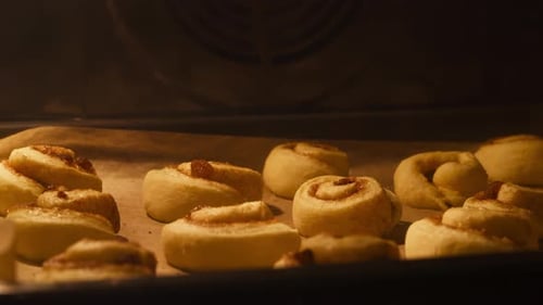 Baking Cinnamon Rolls In The Oven. - closeup shot, timelapse