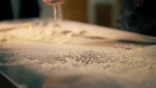 Close Up in a Professional Kitchen in a Pizzeria Young Chef in a Black Uniform Prepares Pizza Dough