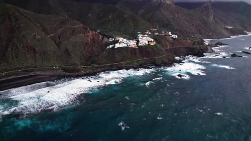 Aerial of green epic ocean coast town in Anaga mountain, Tenerife