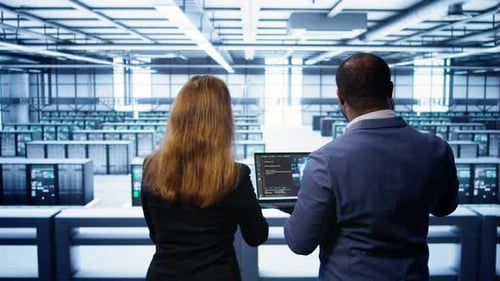 Teamworking Programmers in Data Center Overseeing Server Operations