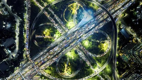 Aerial View City at Night Time Lapse Car Traffic in Business District Background
